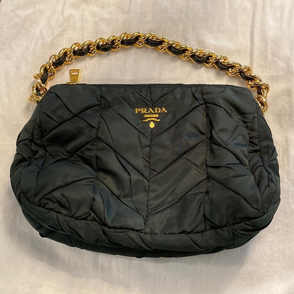 Green Prada quilted bag with gold link chain.
